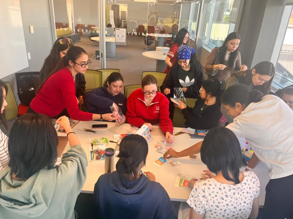 Circle K members assembling care packages together at a table
